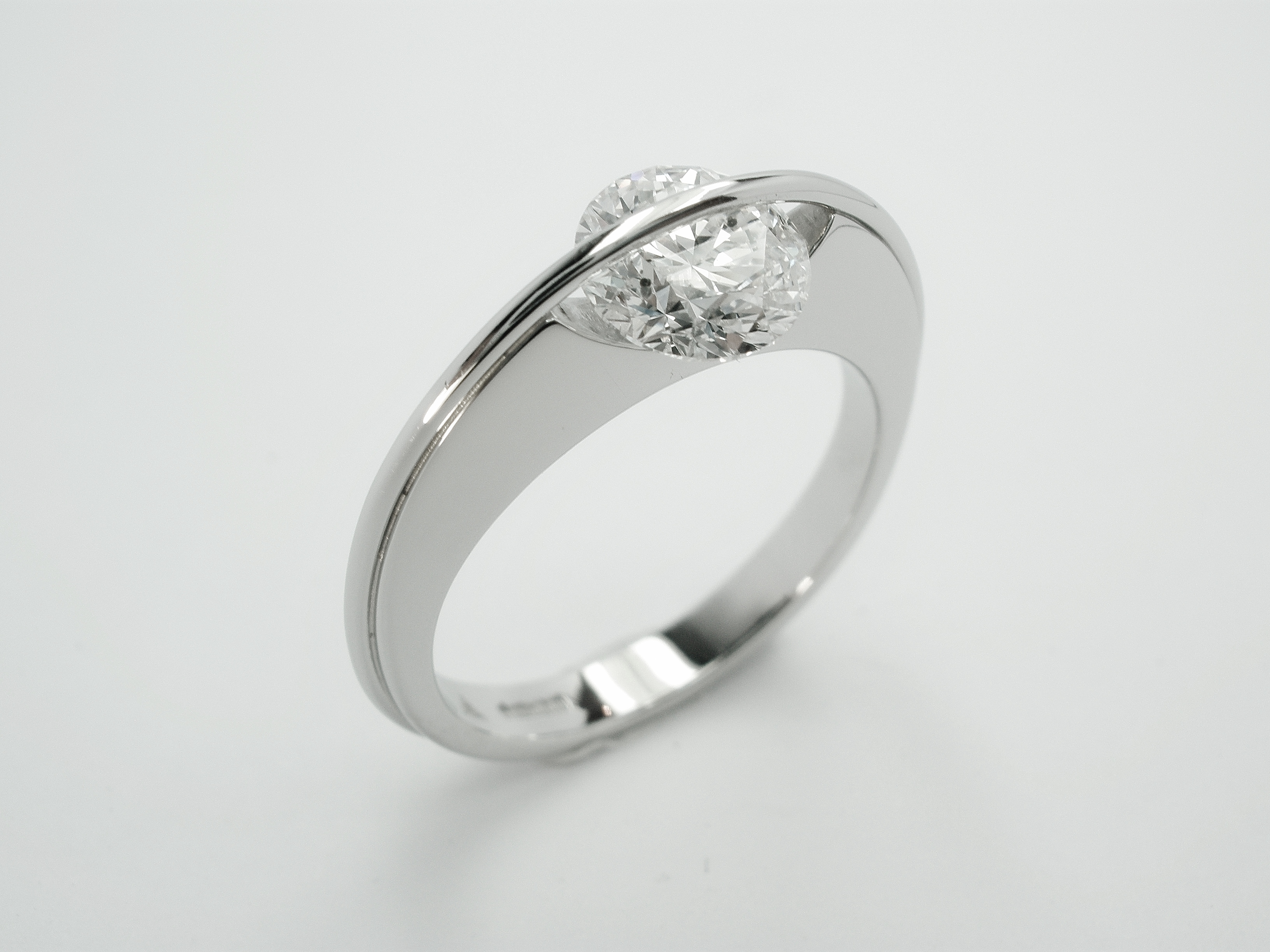 Platinum single stone 1.07ct. 'F' colour round brilliant cut diamond 'Lunar' style ring. Ideal diamond sizes from 0.50ct. to 1.25ct.