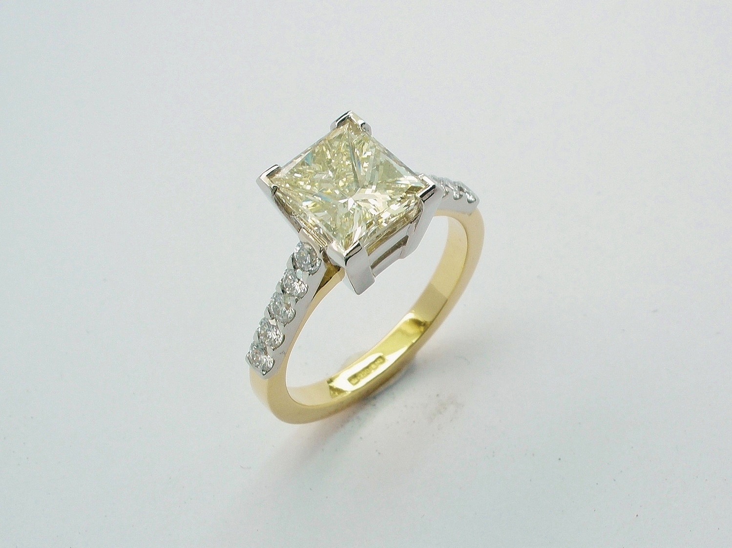 Champagne coloured Princess cut 2.01ct. diamond ring mounted in 18ct. yellow gold & platinum with 'D' coloured round brilliant cut diamonds in shoulders. Ideal diamond sizes 0.50ct to 4.00ct.