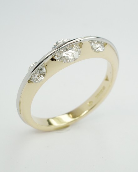 3 stone round brilliant cut 'D' colour diamond 'Lunar' ring mounted in 18ct. yellow gold and platinum. Ideal size of centre diamond 0.45ct to 0.75ct.