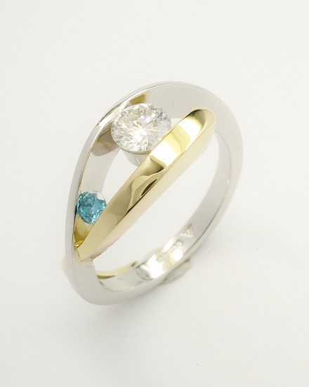 Platinum & 18ct. yellow gold open cross-over 2 stone white & sky blue round brilliant cut diamond ring. Ideal main diamond sizes from 0.35cts. to 0.60cts. & sky blue diamond in proportion.