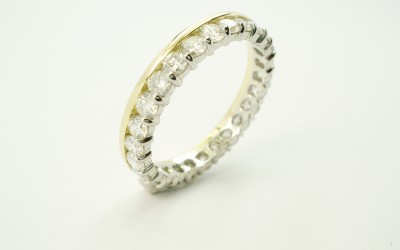 18ct. yellow gold & platinum part channel set diamond full hoop eternity ring.
