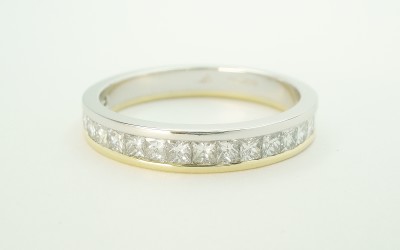 Princess cut diamond platinum & 18ct. yellow gold channel set wedding ring to 55% cover.