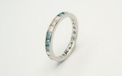 Ocean blue diamond & white diamond full channel set platinum eternity ring.