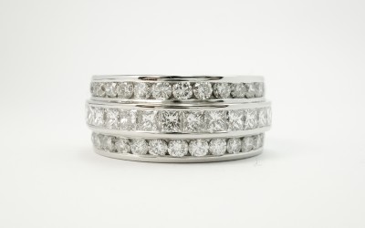 Princess cut diamond and round brilliant cut diamond triple platinum wedding ring set to 55% cover.