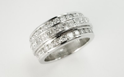 Princess cut diamond and round brilliant cut diamond triple platinum wedding ring set to 55% cover.