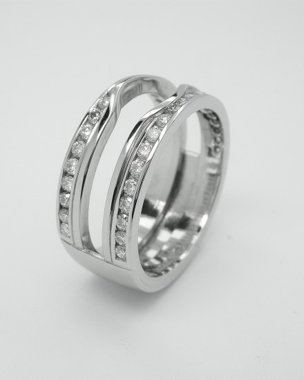 Double 'Embrace' platinum wedding ring channel set with round brilliant diamonds & created to receive the insertion of a single stone round diamond engagement ring.