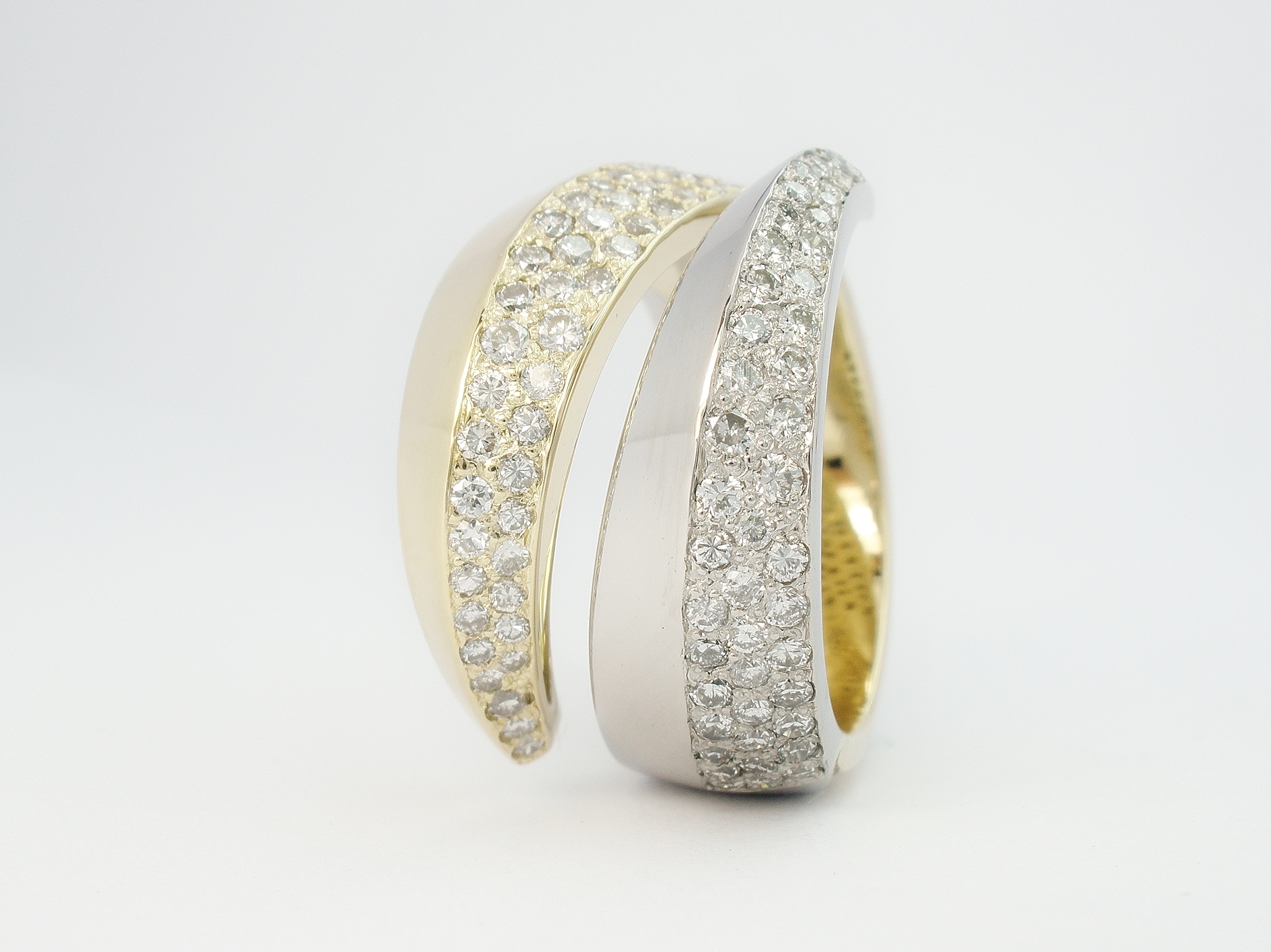 18ct. yellow gold & palladium pave set round brilliant cut diamond triangular sectioned wrap over ring.