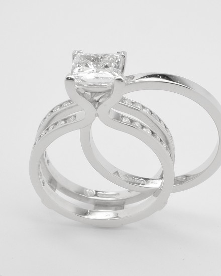 Single stone 1.19ct.'D' colour princess cut diamond 'Embrace' ring set in platinum. The twin shank allows for the insertion of a plain platinum wedding ring.