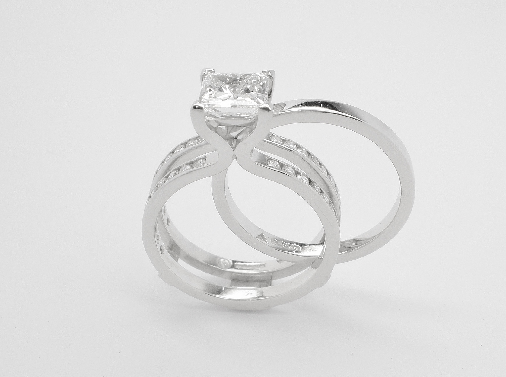 Single stone 1.19ct.'D' colour princess cut diamond 'Embrace' ring set in platinum. The twin shank allows for the insertion of a plain platinum wedding ring.