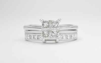 Palladium wedding ring shaped to fit 4 stone princess cut cluster engagement ring, & channel set with princess cut diamonds on either side of raised wires shaped to let in cluster.