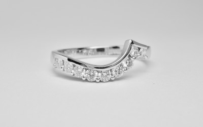 Part channel & wire set diamond wedding ring mounted in platinum & shaped to fit a single stone cross-over diamond engagement ring.