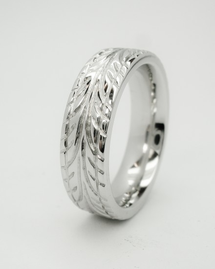 Gents platinum heavy sectioned flat court wedding ring, the cross section to mimic a low profile car tyre with a tyre tread pattern carved around.