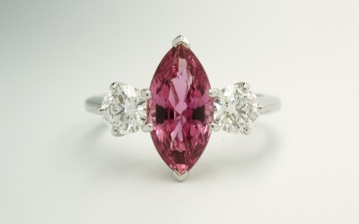 Marquise sapphire & round brilliant cut diamond 3 stone ring mounted in palladium & platinum.
