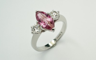 Marquise sapphire & round brilliant cut diamond 3 stone ring mounted in palladium & platinum.