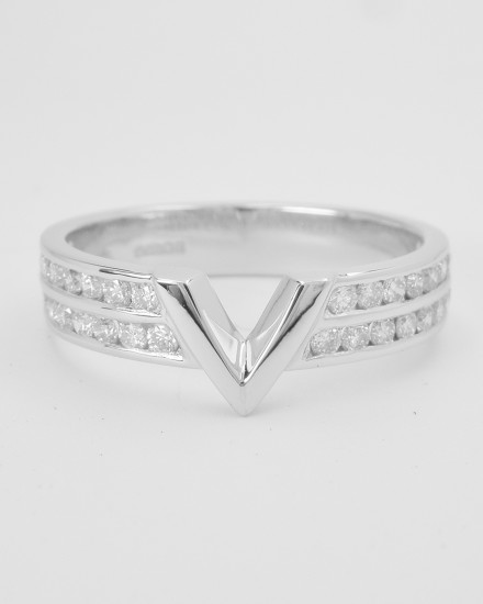 Double channel set round brilliant cut platinum wedding ring shaped with a fine 'V'shaped panel in centre to allow a diamond marquise ring with baguette shoulders to fit in.