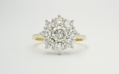 My remodel of 9 stone round brilliant cut diamond cluster in 18ct. yellow gold & platinum.