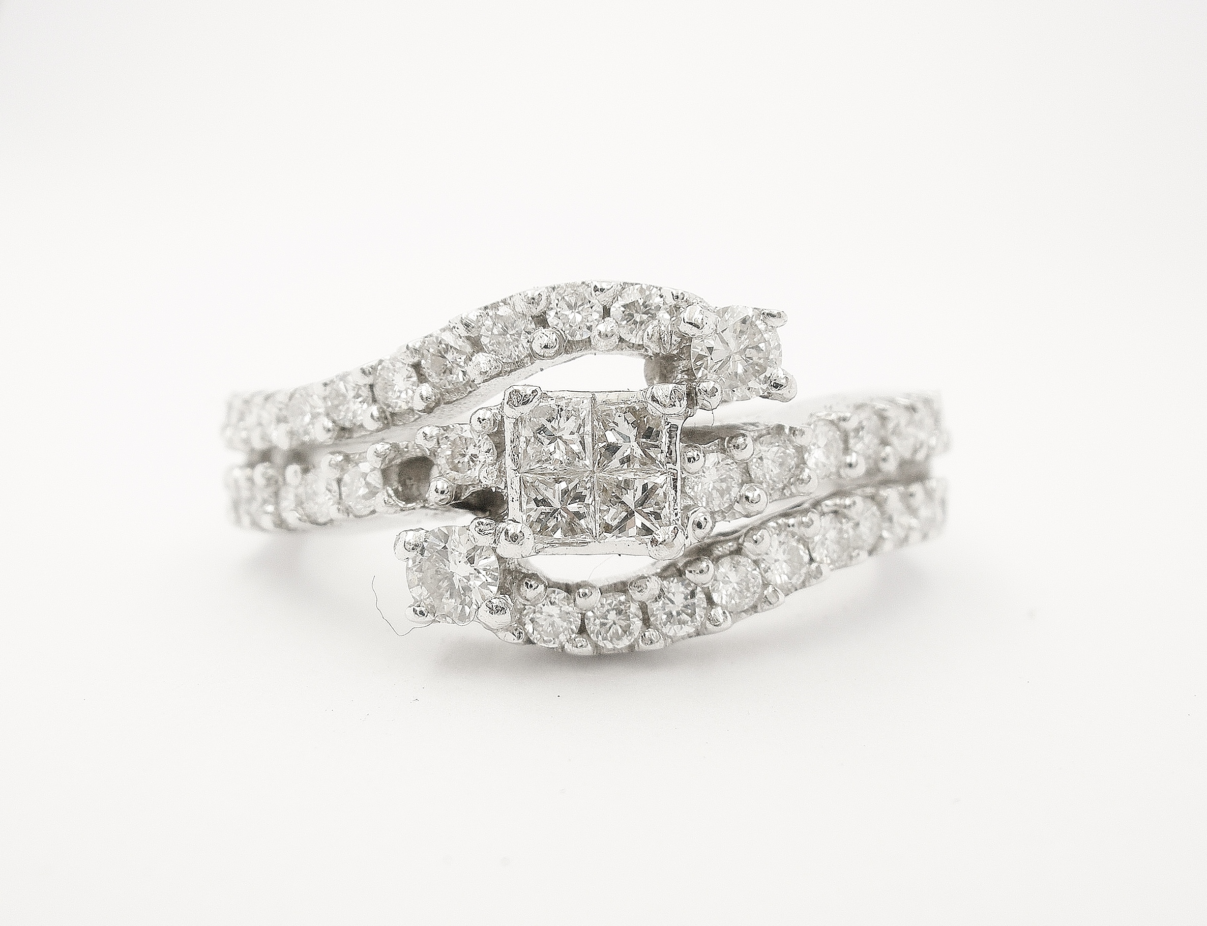 Original princess cut & brilliant cut diamond 18ct white gold ring bought abroad - diamonds repeatedly fell out.