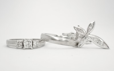 3 stone diamond princess cut ring, diamond set cross & plain platinum wedding ring to remount using platinum wedding ring into 1 ring.