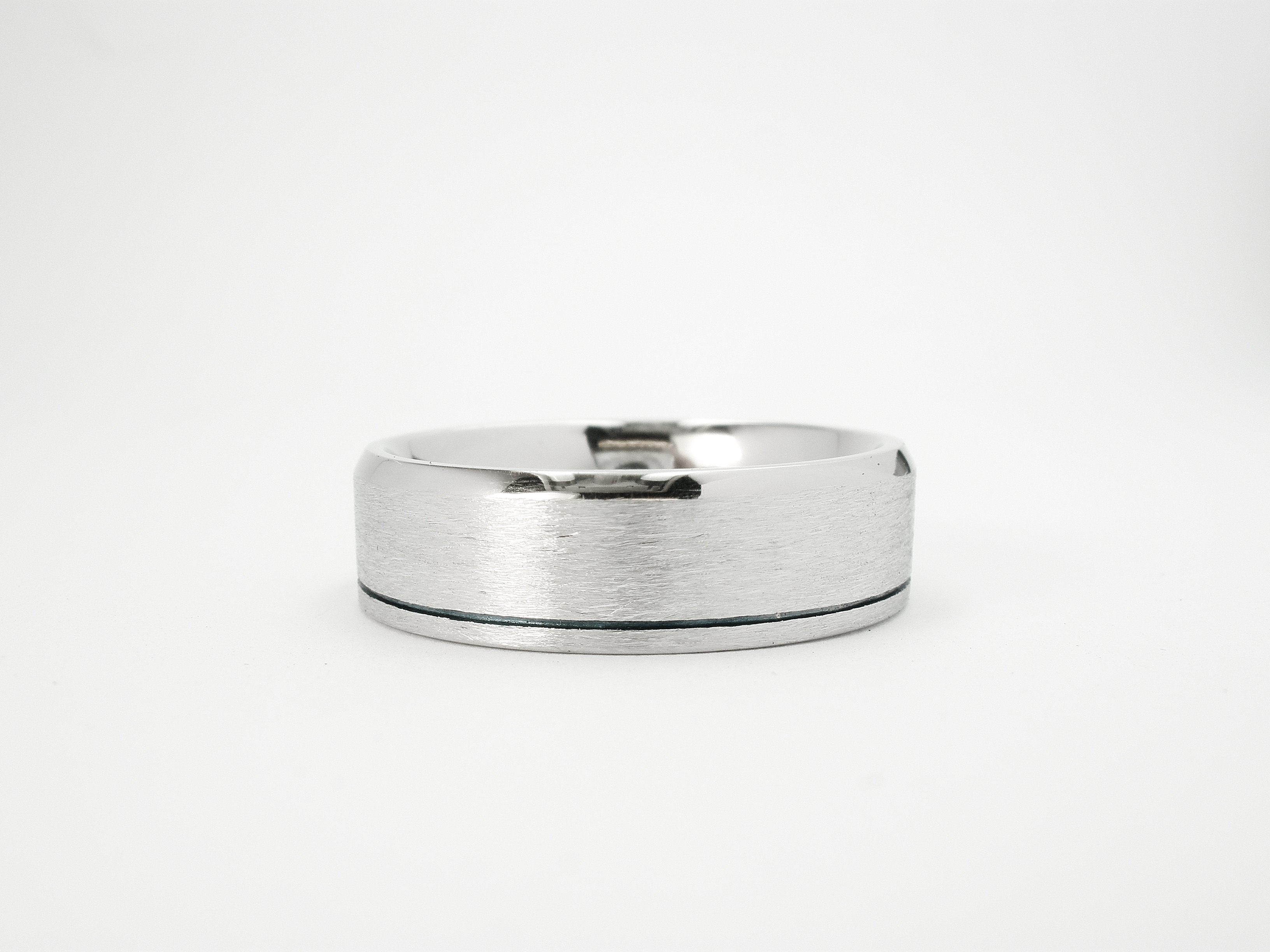 Gents palladium flat court sectioned wedding ring with a brushed finish & 1 polished bevelled edge and a darkened line cut inside the opposite edge.