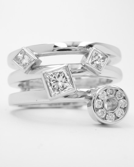 Diamonds remodelled into a triple banded ring, palladium outer rings with the plain platinum wedding ring in the centre & the diamonds rub-over set in platinum.