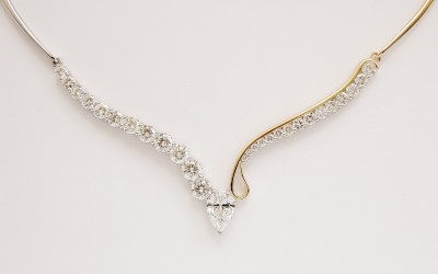 Bespoke Single Pear shaped diamond & 27 stone round brilliant cut diamond necklace mounted in platinum & 18ct.yellow gold with individually hand crafted links.