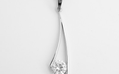 Single stone round brilliant cut diamond curved wishbone style palladium pendant.