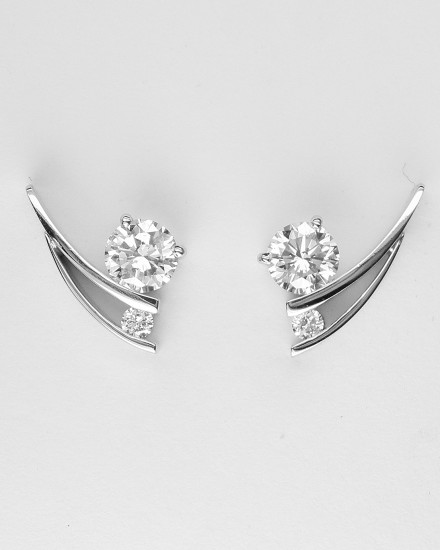 Tick style Platinum & palladium set 2 stone round brilliant cut diamond stud earrings.