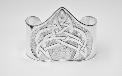 Sterling silver broad cuff torque bangle hand carved with an original Celtic designed pattern.