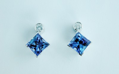 Princess cut tanzanite and brilliant cut diamond earring studs.