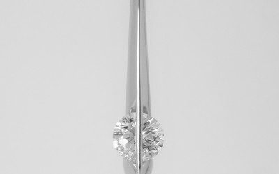 Palladium & platinum set single stone round brilliant cut 'floating' diamond pendant.