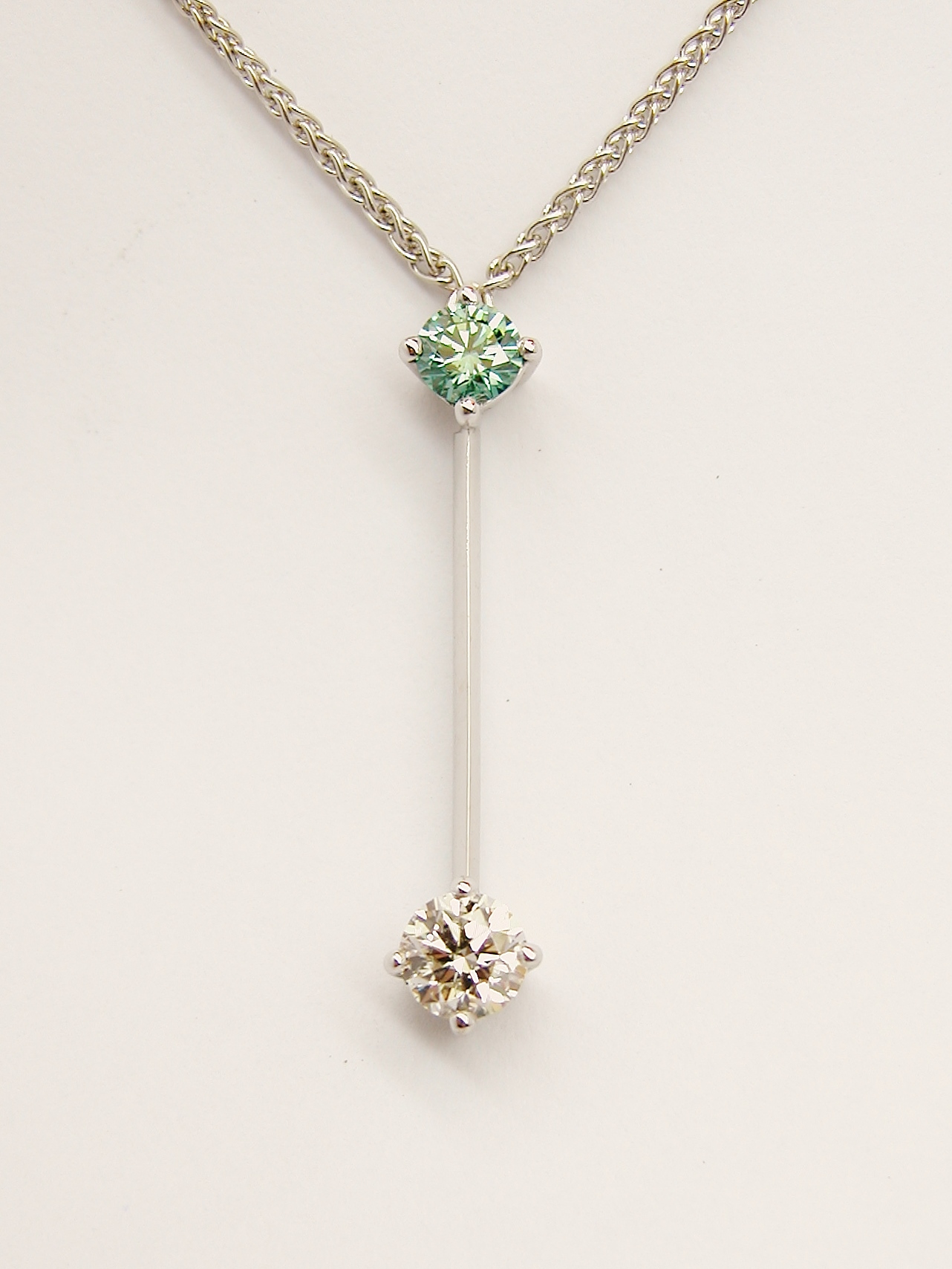 Ocean Blue diamond & white diamond 18ct.white gold'pendulum' style pendant_