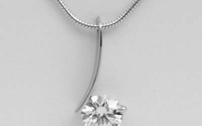 Single round brilliant cut, fine arc wire 'floating' diamond pendant.