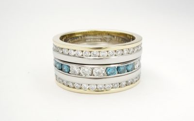 Triple stacking half eternity style white and blue diamond rings mounted in platinum & 18ct. yellow gold.