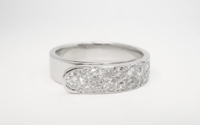 Palladium 'overlap' ring with round brilliant cut diamonds pave set across the top.