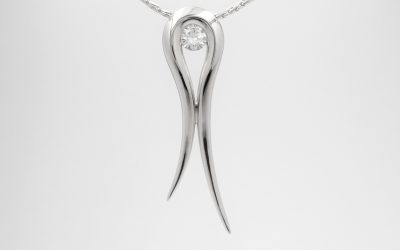 Palladium tapered loop pendant with a single round brilliant cut diamond set in loop.