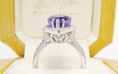 18ct white gold vivid blue-violet eye flawless 5.73ct. tanzanite and diamond (0.36ct) halo ring. SOLD