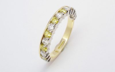 Canary yellow diamond & white diamond eternity ring part channel set to 55% cover, mounted in 18ct. yellow gold and platinum