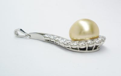Natural golden pearl & part channel set diamond pendant mounted in palladium and platinum.