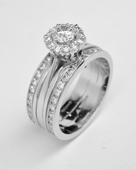 Diamond 'Halo' cluster and double channel set one piece engagement, wedding & eternity ring mounted in palladium and platinum.