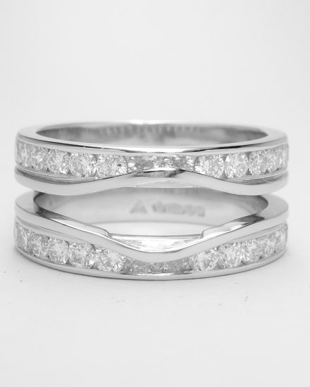 Double 'Embrace' platinum wedding ring channel set with round brilliant diamonds & created to receive the insertion of a phoenix cut and baguette diamond.