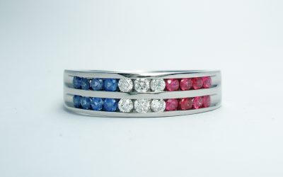 18ct. white gold diamond, sapphire & ruby two row channel set ring.