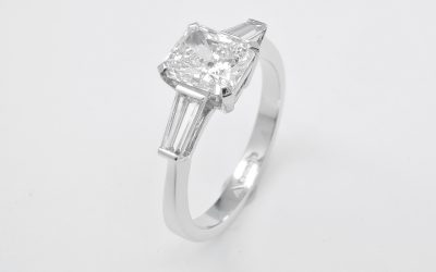 1.20ct. 'D' colour, VS2 clarity radiant cut diamond & tapered baguette diamond ring mounted in platinum.