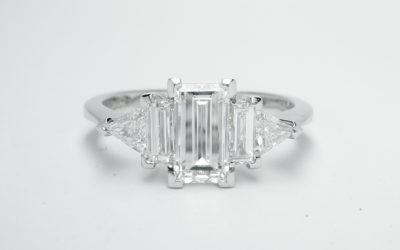 Baguette and triangle cut 5 stone diamond ring mounted in platinum.