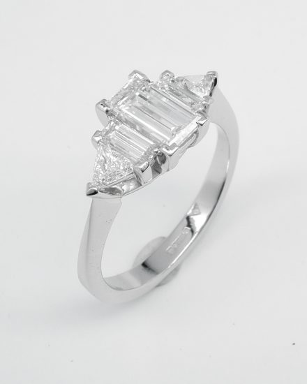 Baguette and triangle cut 5 stone diamond ring mounted in platinum.