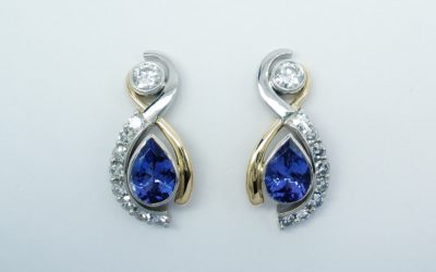 Pear tanzanite and round brilliant cut diamond ear studs mounted in platinum and 18ct. yellow gold.