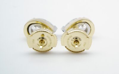 A pair of 1.00ct. pear shaped diamond ear studs mounted in platinum and 18ct. yellow gold with 'Guardian' safety spring fittings