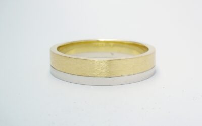 A brushed finish 18ct. yellow gold & polish finished platinum gents wedding ring.