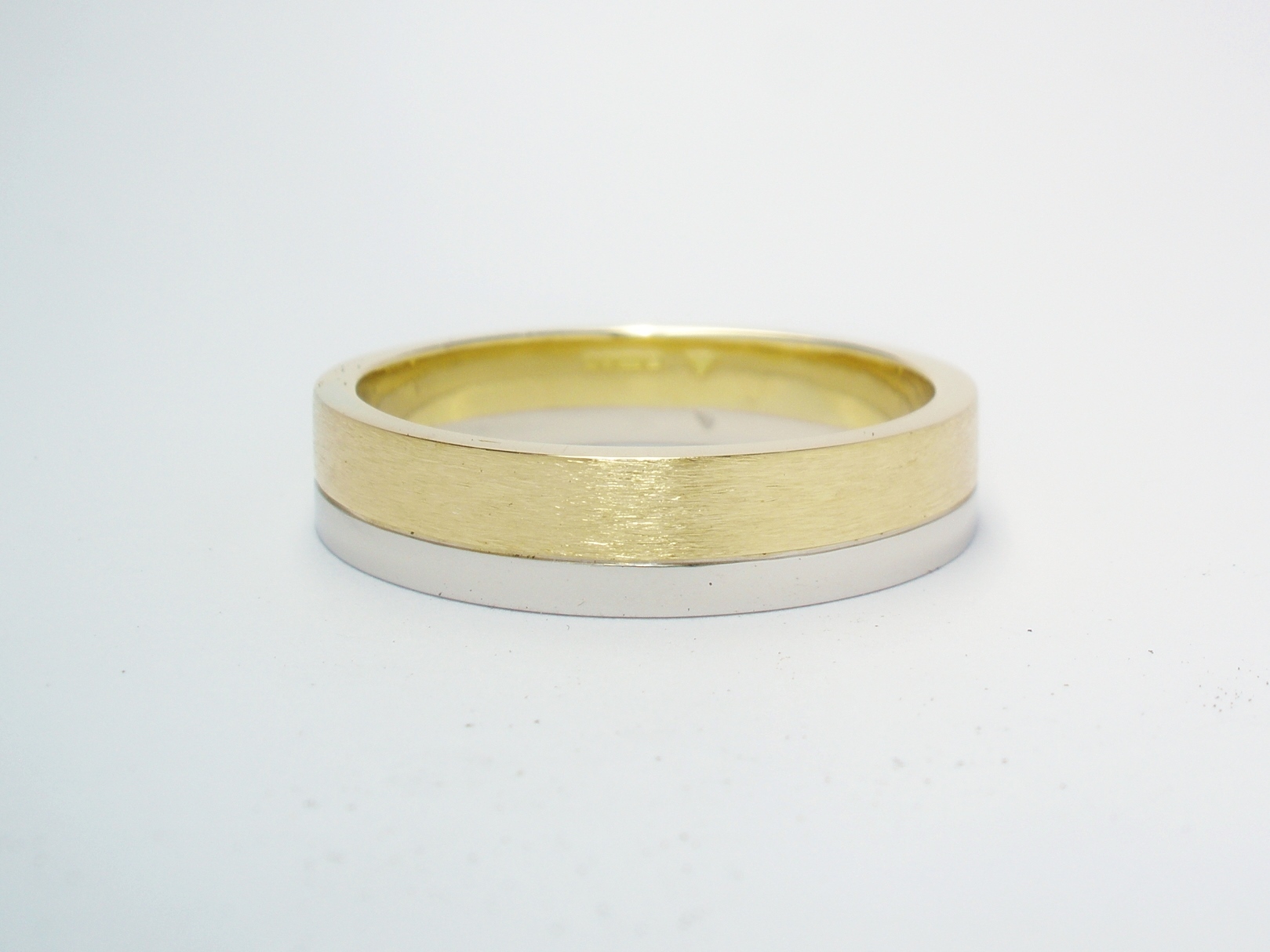 A brushed finish 18ct. yellow gold & polish finished platinum gents wedding ring.
