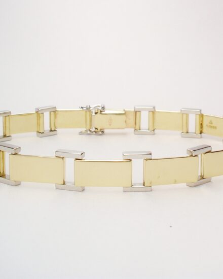 9ct gold and platinum panel bracelet with 9ct gold box catch and a pair of platinum figure 8 safety catches.