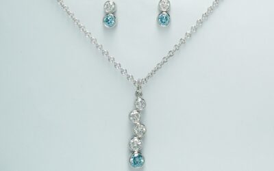 The 5 stone sky blue and white tumble pendant along with the complimenting 2 stone sky blue and white diamond ear studs